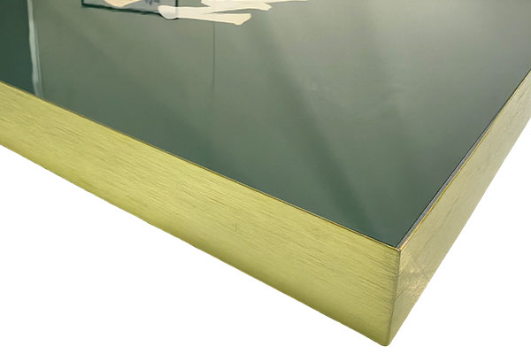 How durable is PVC Tempered Film Metal Edge Imitation Acrylic material in furniture decoration?